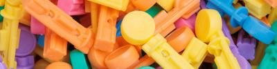 Close-up of colourful injection-moulded plastic components, suitable for plasma surface treatment to improve printing, coating, or adhesive bonding performance