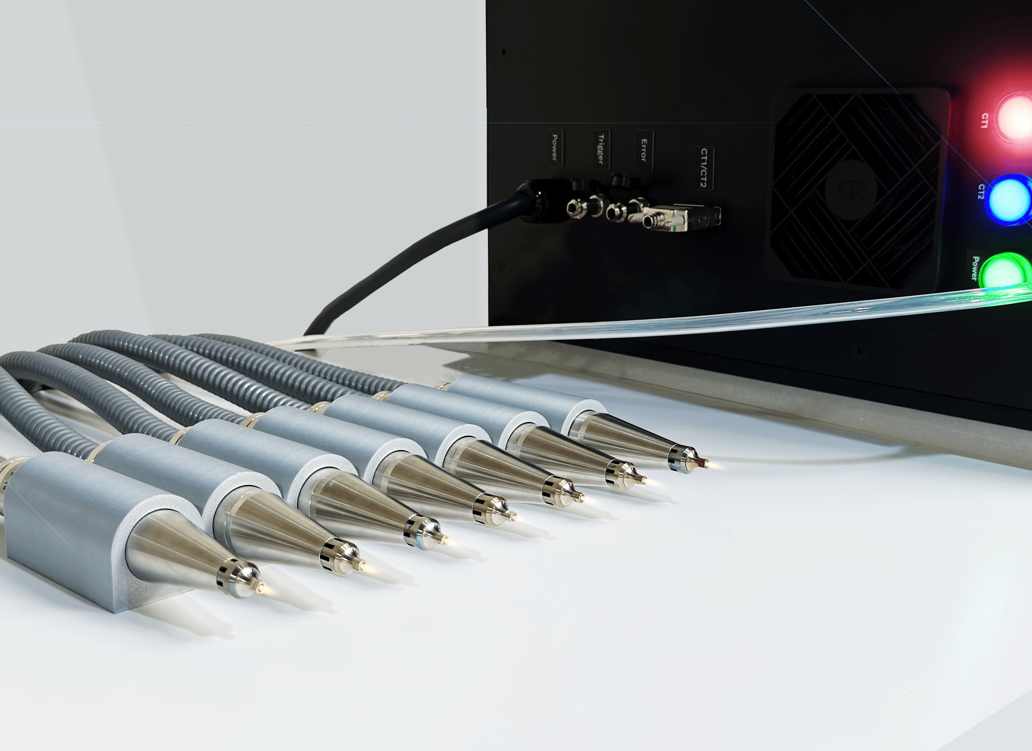 Seven Altus atmospheric plasma nozzles arranged side by side, with the controller's power, trigger and error connections behind