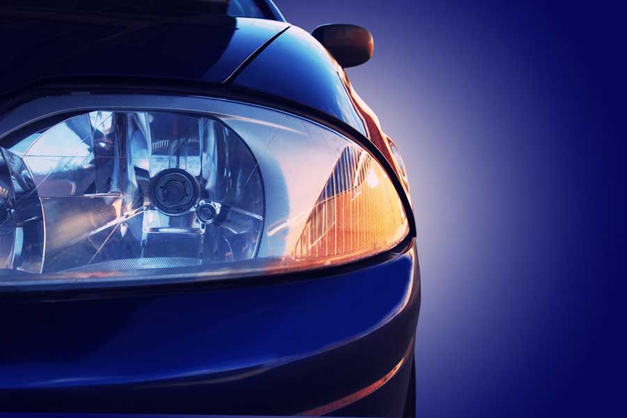 Close up of automotive headlight assembly, vehicle lighting component for automotive manufacturing and surface coating applications